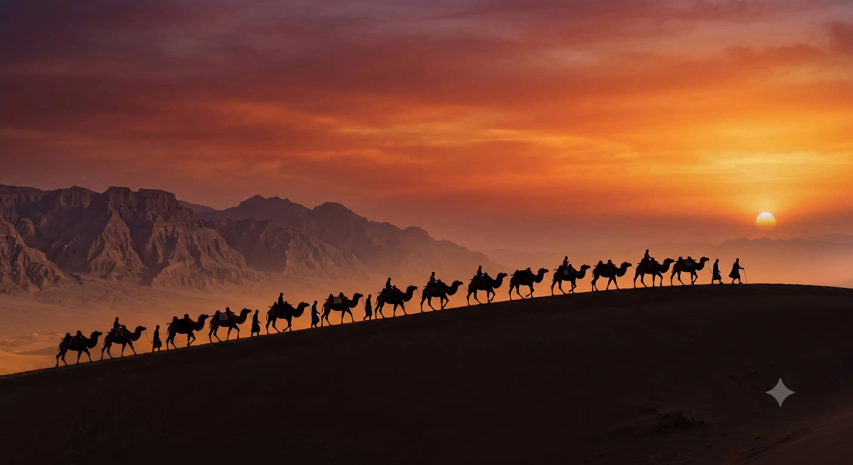 Epic silhouettes of a camel caravan walking along the crest of the Gobi desert at sunset