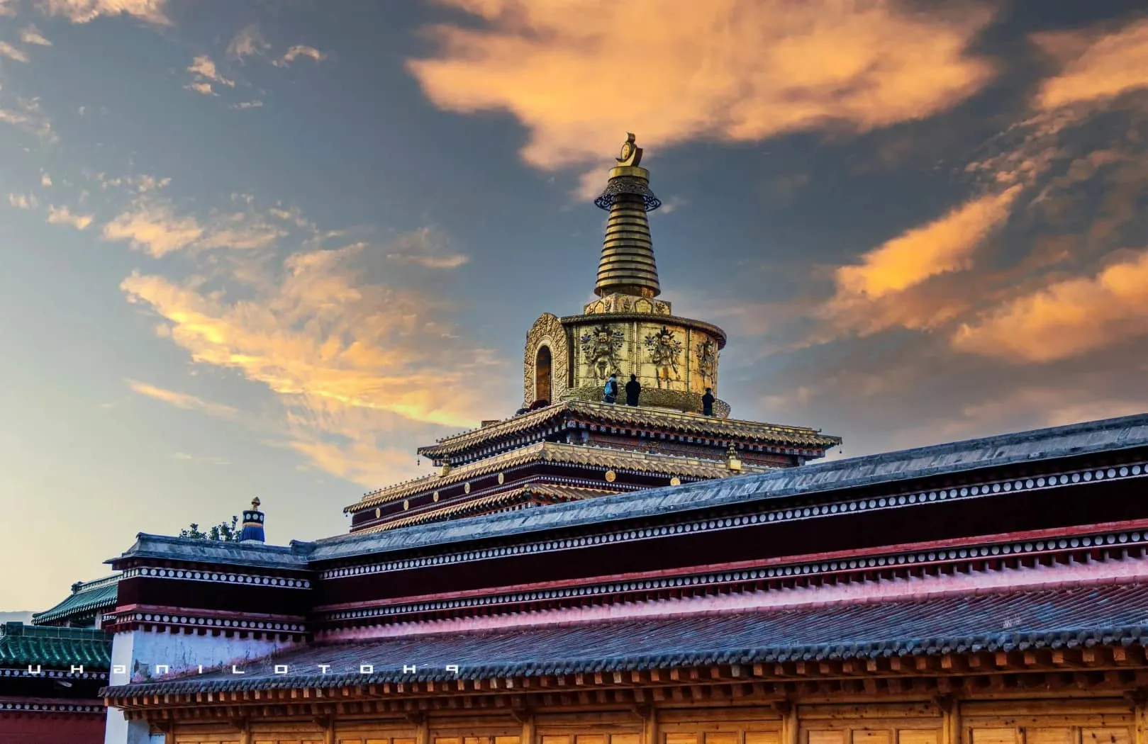 The sweeping panoramic view of Labrang Monastery’s golden roofs glistening in the afternoon sun